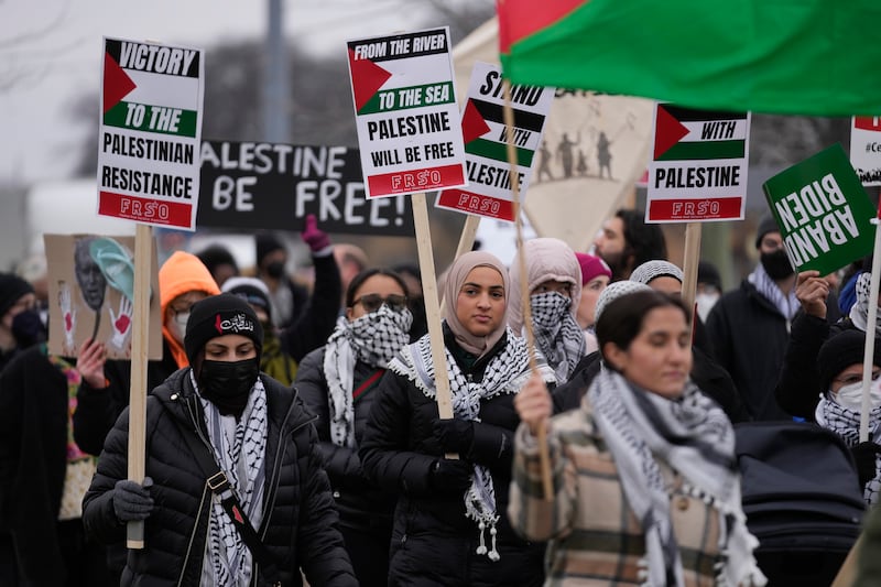 Pro-Palestinian demonstrators march during a visit by President Joe Biden in Warren, Michigan. AP