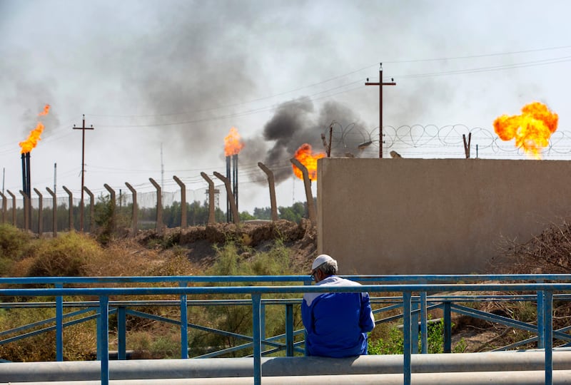 Flare stacks burning off excess gas at the Nahr Bin Omar oilfield in Iraq's southern province of Basra. AFP