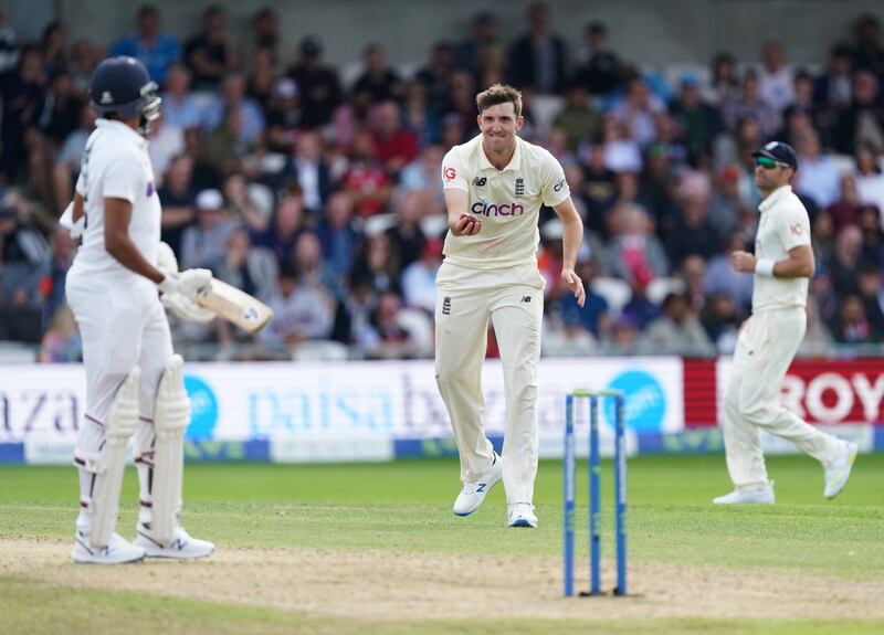 England's Craig Overton, center, reacts after dismissing India's Mohammad Siraj. AP