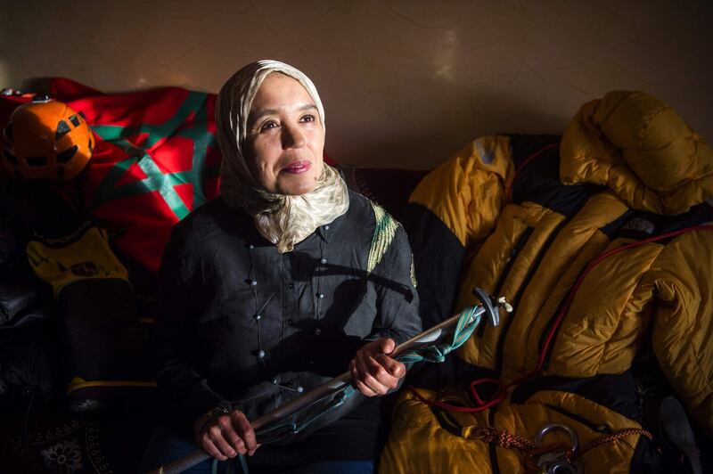 Moroccan mountaineer Bouchra Baibanou is pictured in her home  with a hiking cane in the Sidi Moussa district of Sale near Rabat. She is the first Moroccan to scale the seven summits of the world's continents.  AFP