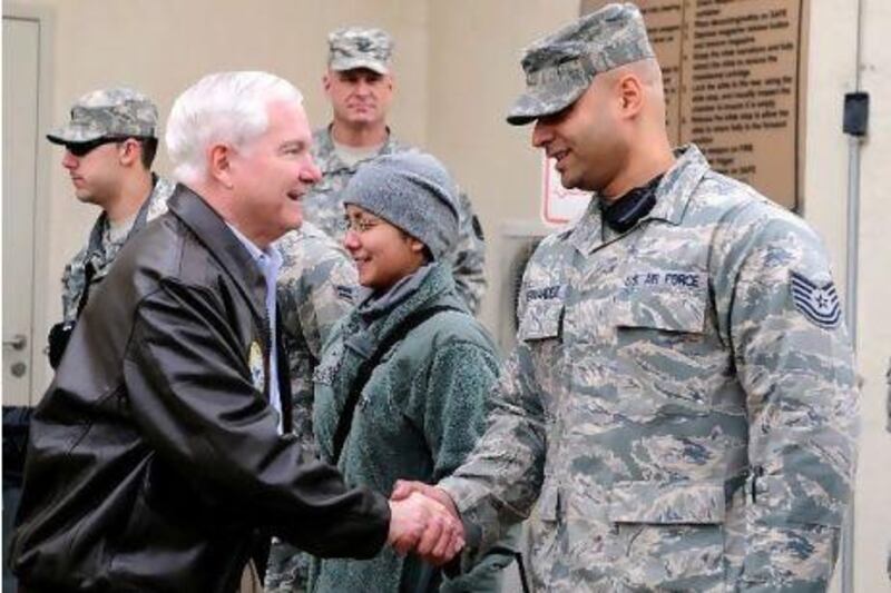 Defence secretary Robert Gates meets troops outside a hospital in Kabul.