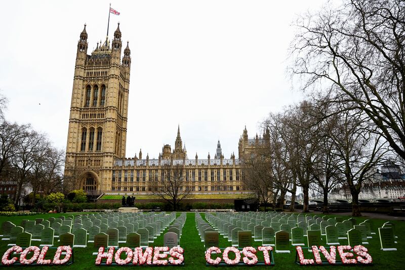 A graveyard built from insulation boards by Greenpeace activists outside the Houses of Parliament in London warns the UK government that the failure to insulate homes is costing lives. Reuters