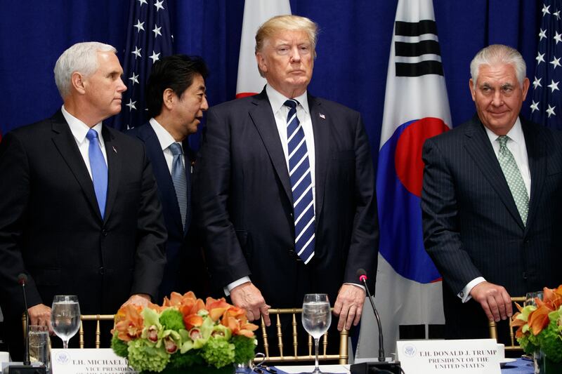 Japanese Prime Minister Shinzo Abe walks to his seat at a luncheon with President Donald Trump and South Korean President Moon Jae-in at the Palace Hotel during the United Nations General Assembly, Thursday, Sept. 21, 2017, in New York. From left, Vice President Mike Pence, Abe, Trump, and Secretary of State Rex Tillerson. (AP Photo/Evan Vucci)
