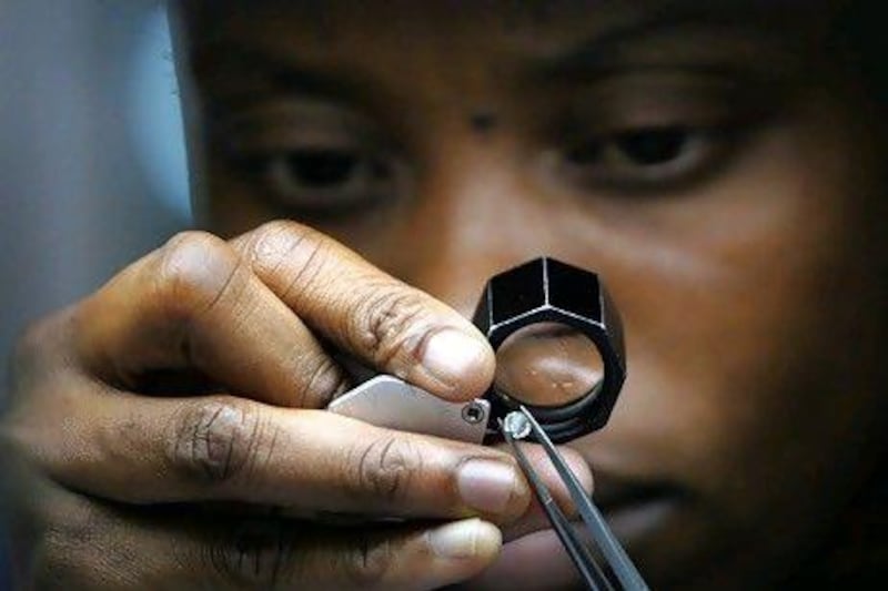 Do your homework and consider 10 key elements before investing in diamonds. AFP Photo / Alexander Joe