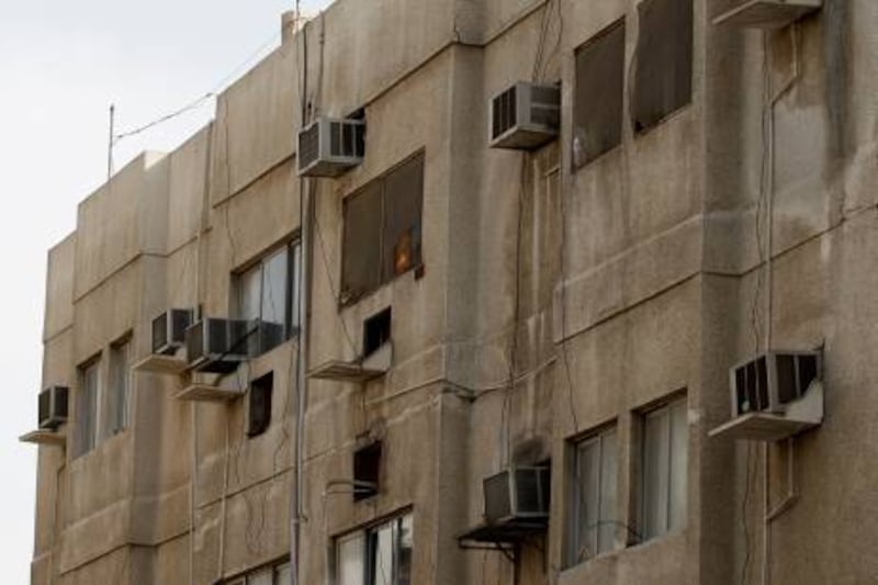 ABU DHABI, UNITED ARAB EMIRATES - April 14, 2008: Dirty air conditioners contribute to an illness known as Red Death, seen at 4th Street and 15th Street in Abu Dhabi. ( Ryan Carter / The National ) *** Local Caption *** na16reddeath.JPG