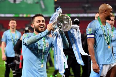 LONDON, ENGLAND - FEBRUARY 24: Bernardo Silva of Manchester City celebrates with the trophy after winning the Carabao Cup Final between Chelsea and Manchester City at Wembley Stadium on February 24, 2019 in London, England. (Photo by Michael Regan/Getty Images)