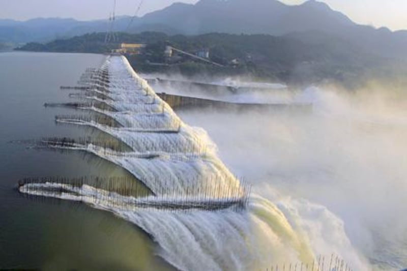 This image provided by the Gujarat state information department, Tuesday, Sept. 15, 2009,  shows the overflowing Sardar Sarovar dam on the Narmada River in western India?s Gujarat state on Sunday, Sept. 13, 2009. There has been heavy inflow from the upstream areas in Madhya Pradesh authorities have sounded an alert in case of floods. (AP Photo/ Gujarat State Information Department)  **  EDITORIAL USE ONLY  **