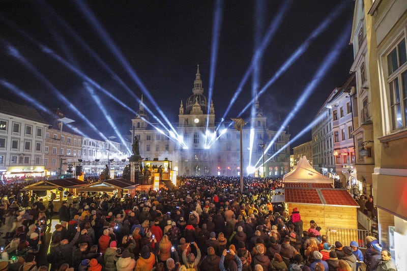 Hundreds attend a water and laser show on the main square in Graz, Austria.  AFP