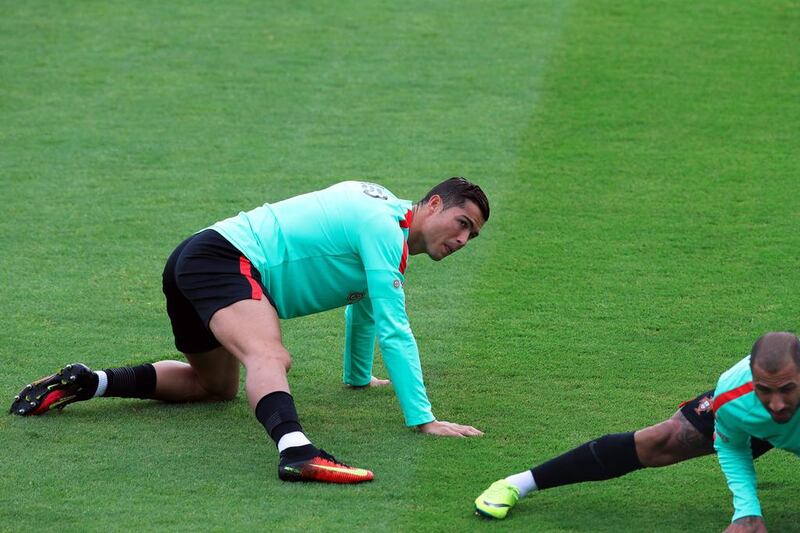 ortugal’s Cristiano Ronaldo stretches during a training session in Marcoussis, near Paris, France. (AP Photo/Thibault Camus)