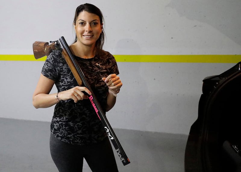 Lebanese trap shooter Ray Bassil is pictured during a training session for this summer's Olympics in her underground parking in Sahel Alma near the coastal city of Jounieh, north of the capital Beirut, on February 5, 2021. - Determined to stay fit despite the coronavirus pandemic, the 32-year-old turned the parking spaces under her apartment block into a virtual firing range, all without shooting a single round.
Bassil herself had fallen ill from Covid-19, but sprang back into training despite the round-the-clock curfew. (Photo by JOSEPH EID / AFP)