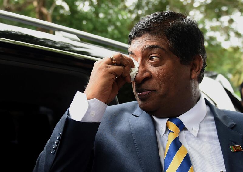 Former Sri Lankan foreign minister Ravi Karunanayake reacts after resigning in Colombo on August 10, 2017. 
Karunanayake has resigned after being linked to a controversial financial trader under investigation for allegedly causing millions of dollars of losses to the island's coffers. Ravi Karunanayake, 54, stepped down from the cabinet amid questioning over his connection to an insider trading scandal at Sri Lanka's central bank after the new government was elected in January 2015. / AFP PHOTO / ISHARA S. KODIKARA