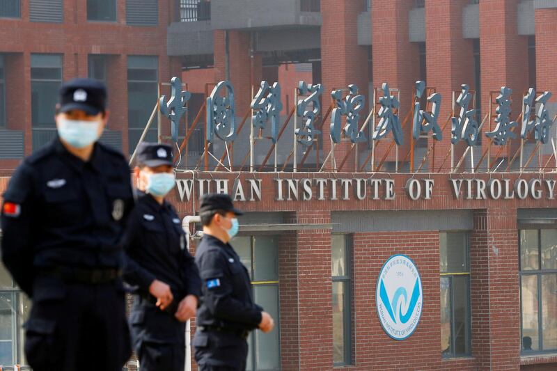 Security personnel keep watch outside the Wuhan Institute of Virology during the visit by the WHO team tasked with investigating the origins of coronavirus in Wuhan, Hubei province. Reuters