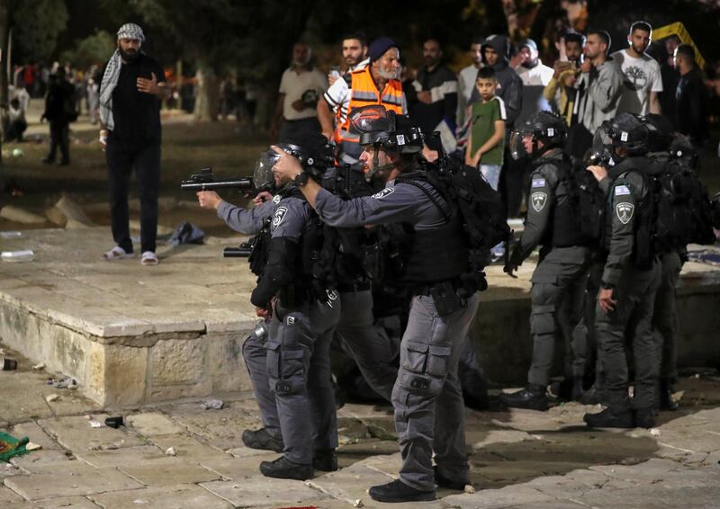 Israeli police aim their weapons during clashes with Palestinians at the Al Aqsa Mosque compound. Reuters