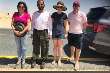 Hanna Karen Arroyo thanked the Ruler of Dubai after he helped to tow her car out of the sand off a desert road on Saturday. She shared this image of her and her friends with Sheikh Mohammed on Twitter. Courtesy: Hanna Karen Arroyo / Twitter