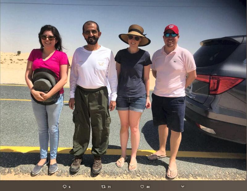 Hanna Karen Arroyo thanked the Ruler of Dubai after he helped to tow her car out of the sand off a desert road on Saturday. She shared this image of her and her friends with Sheikh Mohammed on Twitter. Courtesy: Hanna Karen Arroyo / Twitter