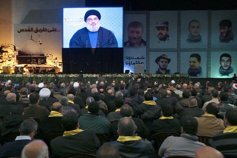 Hassan Nasrallah, the head of Lebanon’s militant Shiite Muslim movement Hizbollah, addresses supporters through a giant screen on January 30, 2014. Joseph Eid / AFP 