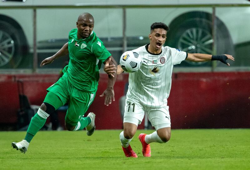 Arabian Gulf League final round: Al Jazira v Khorfakkan at Mohamed bin Zayed stadium. Abdulla R. of Jazira battles for possesion with  Alhammadi of Khorfakkan during the first half of the game on May 11th, 2021. Victor Besa / The National.