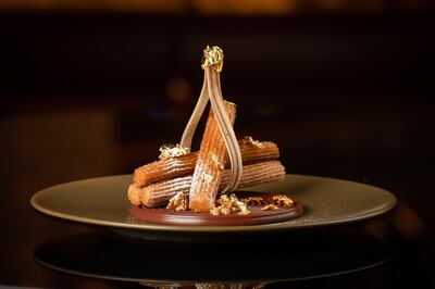 Golden Jubilee churros with luqaimat flavour, date ice cream and 24K gold flakes. Photo: Hilton