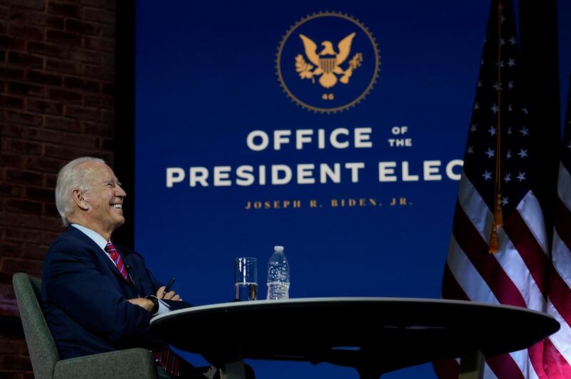 President-elect Joe Biden smiles as he meets virtually with the United States Conference of Mayors at The Queen theater Monday, Nov. 23, 2020, in Wilmington, Del. (AP Photo/Carolyn Kaster)