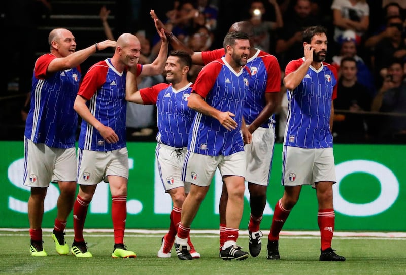 France 98's players celebrate after Zinedine Zidane scored a goal. Thomas Samson / AFP