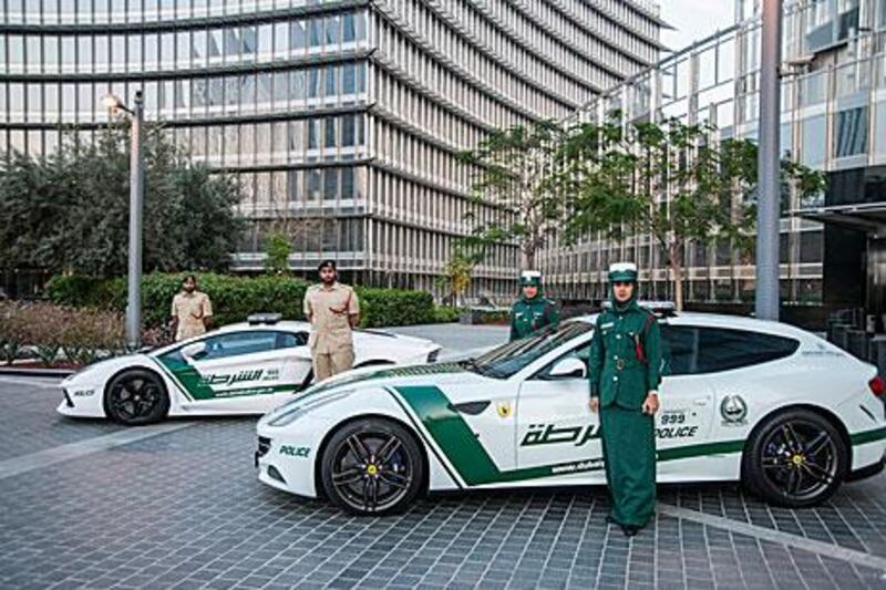 The Lamborghini Aventador, left, and the Ferrari FF were the first supercars to get the Dubai Police decal treatment. Courtesy Dubai Police