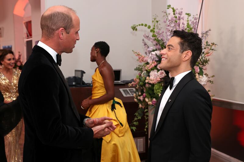 Prince William speaks with actor Rami Malek at the premiere of 'No Time to Die' in London on September 28, 2021. Reuters