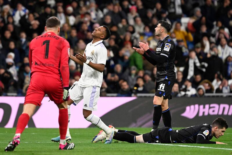 Real Madrid forward Rodrygo reacts as Real Sociedad midfielder Igor Zubeldia lies on the pitch. AFP