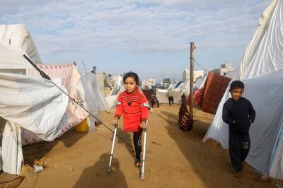 Displaced Palestinian children who fled their homes because of Israeli strikes, shelter in a tent camp. Reuters