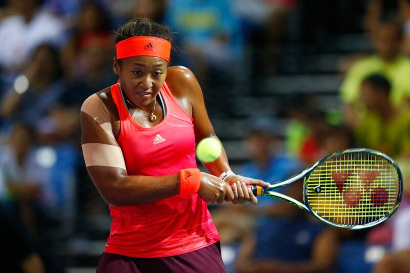 SINGAPORE - OCTOBER 24:  Naomi Osaka of Japan in action against Zhu Lin of China in a round robin match during the WTA Rising Stars Invitational at OCBC Arena on October 24, 2015 in Singapore.  (Photo by Julian Finney/Getty Images)