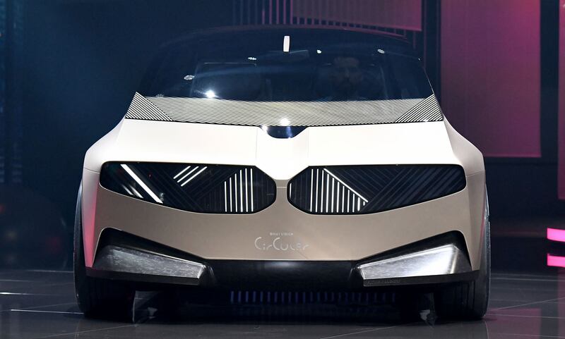 A BMW i Vision Circular concept car stands on the stage during a press presentation. AFP