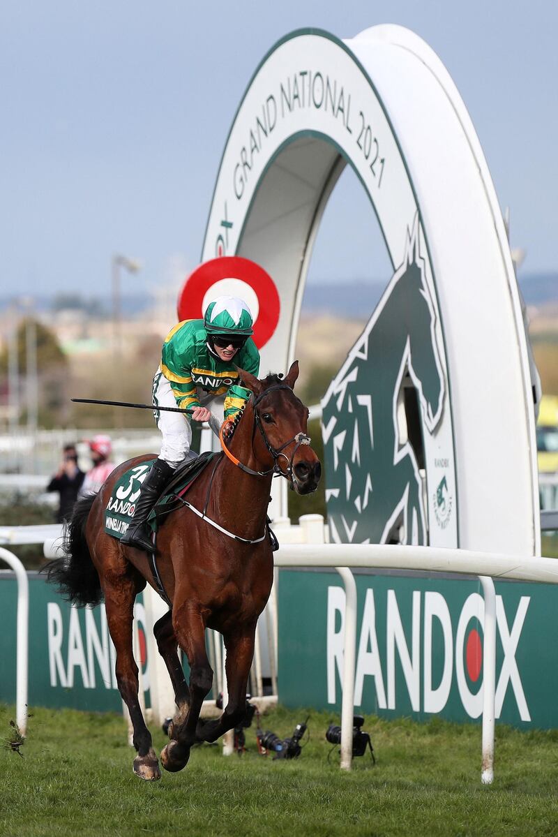 Jockey Racheal Blackmore rides Minella Times to victory at the Grand National. AFP