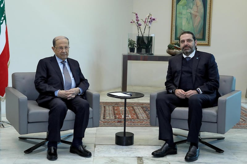 A handout picture provided by the Lebanese photo agency Dalati and Nohra on December 19, 2019 shows Lebanese President Michel Aoun (L) meeting with caretaker Prime Minister Saad Hariri at the presidential palace in Baabda, east of Beirut. (Photo by - / DALATI AND NOHRA / AFP) / === RESTRICTED TO EDITORIAL USE - MANDATORY CREDIT "AFP PHOTO / HO / DALATI AND NOHRA" - NO MARKETING - NO ADVERTISING CAMPAIGNS - DISTRIBUTED AS A SERVICE TO CLIENTS ===