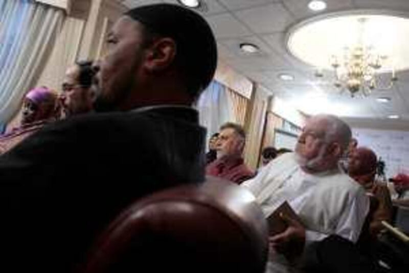 Members of the American-Islamic community including, Asma Hanif (L); Nihad Awad (2nd-L); Mahdi Bray (3rd-L); and Imam, Mohammad Alhanooti (R); watch U.S. President, Barack Obama's address from Cairo at the Council on American-Islamic Realations, June 4, 2009, in Washington, D.C.  *** Local Caption ***  speech6.jpg