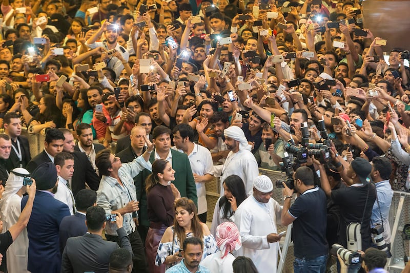 The Bollywood stars wave to the crowd at Dalma Mall. Antonie Robertson / The National