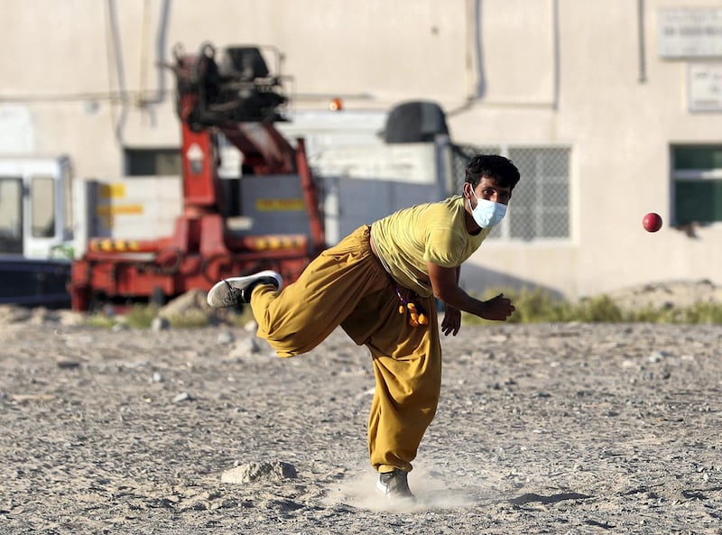 Dubai, United Arab Emirates - Reporter: N/A. News. Coronavirus/Covid-19. A gentleman plays tape ball cricket with a mask on to prevent the spread of Covid-19. Wednesday, October 21st, 2020. Dubai. Chris Whiteoak / The National