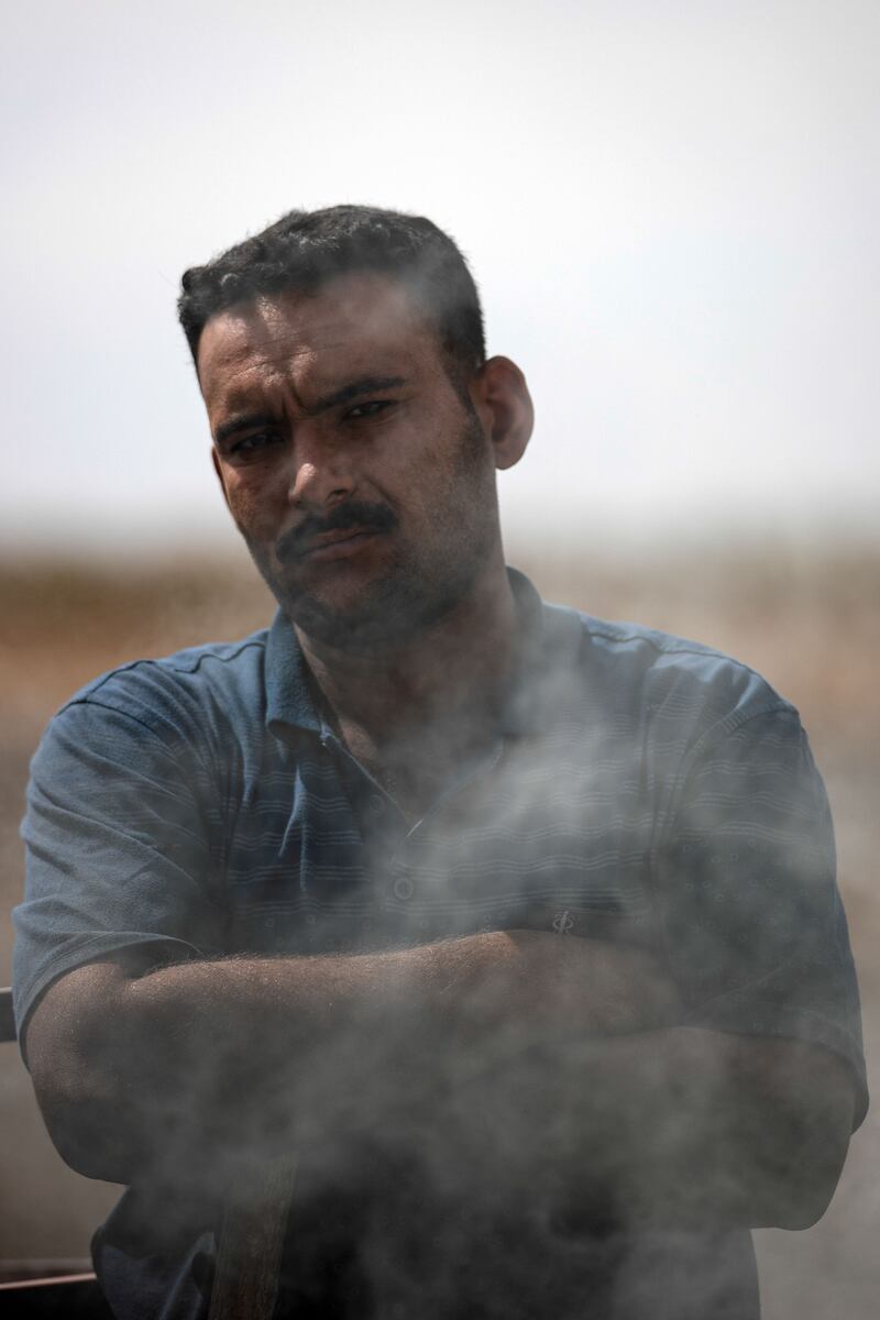 A worker makes charcoal from wood for domestic use in Iraq's southern province of Diwaniyah. All photos: AFP