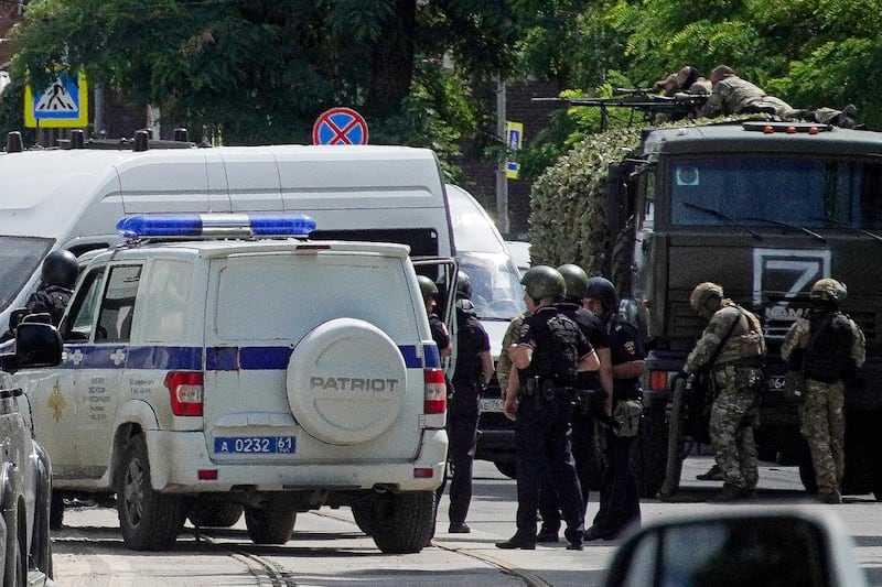 Russian police and security officers in the Rostov region. Authorities say the prisoners behind the incident were 'eliminated'. AP