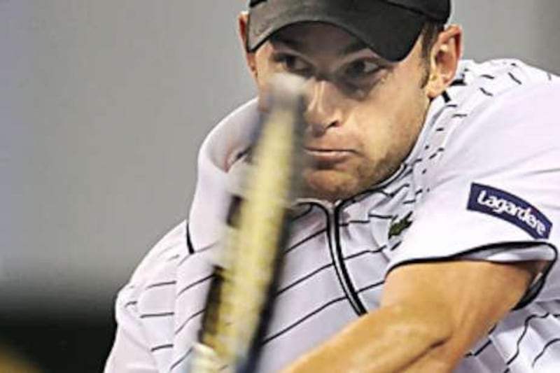Andy Roddick returns against Andy Murray in his only match of the Masters Cup before pulling out with injury.