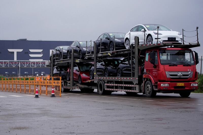 New cars leave Tesla's factory in Shanghai, China. The EV builder is pulling out the stops to promote sales in all its markets. Reuters