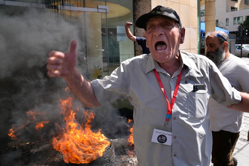 A depositor vents his anger outside a Bank Audi branch in downtown Beirut. AP