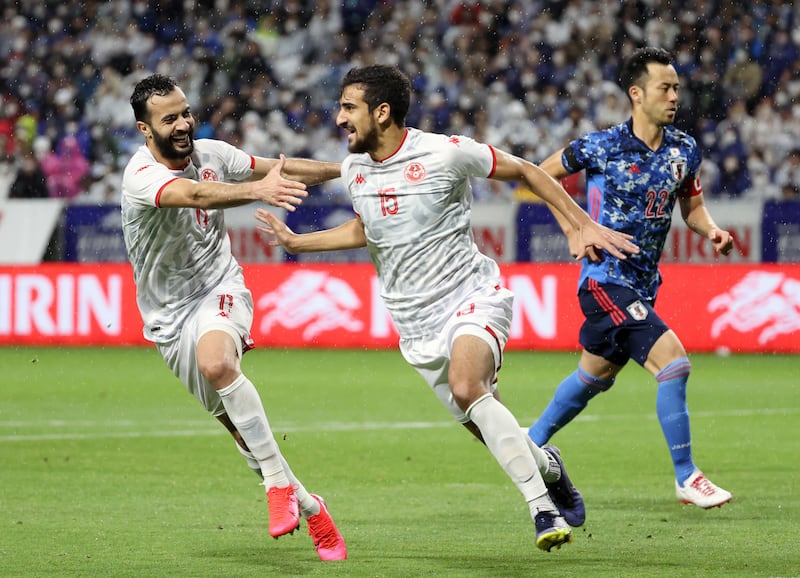 Mohamed Ali Ben Romdhane of Tunisia celebrates after scoring a penalty against Japan in Osaka. EPA