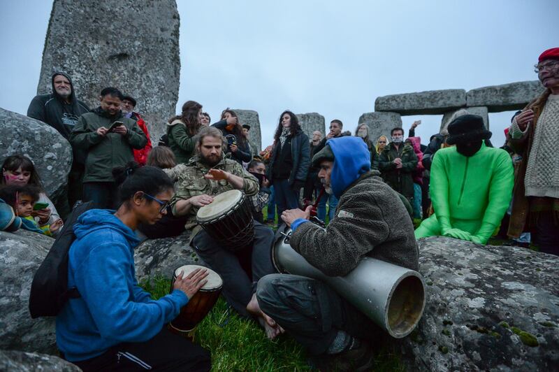 People play drums to celebrate the Summer Solstice at Stonehenge. Getty Images