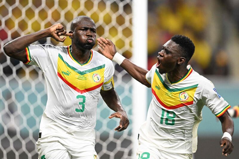 More celebrations for Koulibaly, left, as his team qualified for the knockouts. AFP