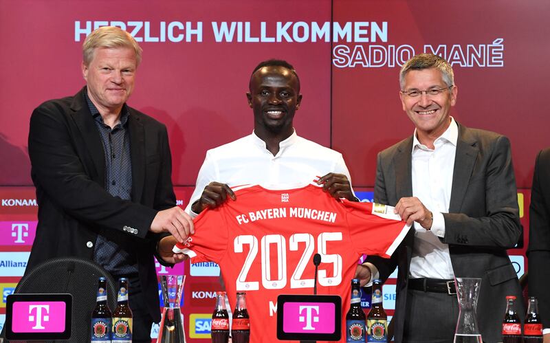 Left to right:  Oliver Kahn, Sadio Mane and Herbert Hainer. Reuters