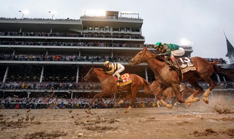 Flavien Prat rides Country House, left, to the finish line during the 145th running of the Kentucky Derby horse race at Churchill Downs. in Louisville, Kentucky. Country House was declared the winner after Maximum Security was disqualified following a review by race stewards. AP