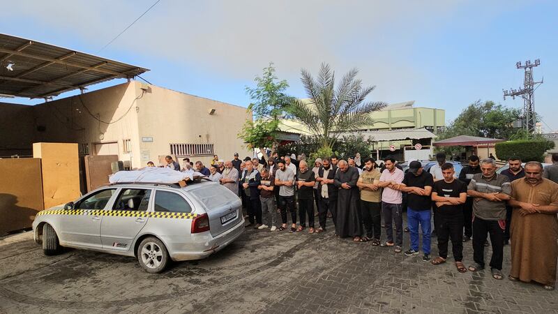 Mourners pray next to the bodies of members of the Daher family, who were killed by Israel strikes, at the Indonesian Hospital in the northern Gaza Strip. Reuters