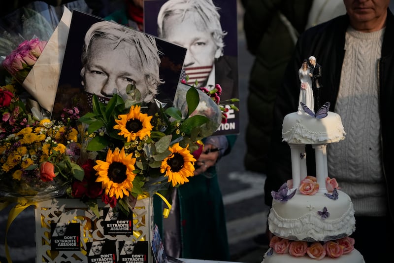 Figurines are displayed on a wedding cake before it was cut by Ms Moris after marrying her partner, the WikiLeaks founder Julian Assange. AP