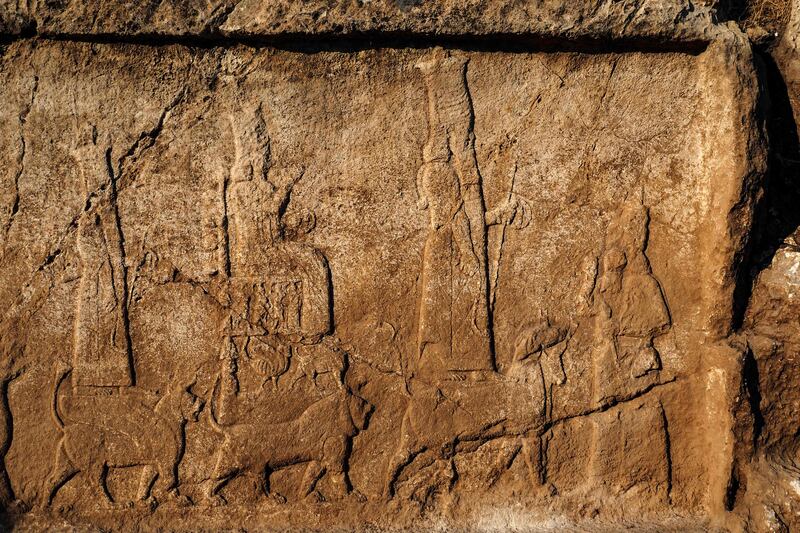 An undated handout picture provided by Terra Di Ninive on October 24, 2021, shows a view of carvings discovered on the walls of an ancient irrigation canal by a team of Kurdish and Italian archaeologists near Faydeh in the Nineveh area of northern Iraq.  - In Iraq, Italian and Kurdish archaeologists announced the discovery of remains dating from the time of the Assyrian kings Sargon II and his son Sennacherib, including a 2,700-year-old wine factory and carvings on the walls of an irrigation canal.  (Photo by Terra Di Ninive  /  AFP)  /  == RESTRICTED TO EDITORIAL USE - MANDATORY CREDIT "AFP PHOTO  /  HO  /  TERRA DI NINIVE" - NO MARKETING NO ADVERTISING CAMPAIGNS - DISTRIBUTED AS A SERVICE TO CLIENTS ==