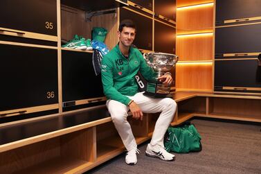 MELBOURNE, AUSTRALIA - FEBRUARY 03: Novak Djokovic of Serbia poses with the Norman Brookes Challenge Cup in the locker room after winning the Men's Singles Final against Dominic Thiem of Austria on day fourteen of the 2020 Australian Open at Melbourne Park on February 03, 2020 in Melbourne, Australia. (Photo by Clive Brunskill/Getty Images)