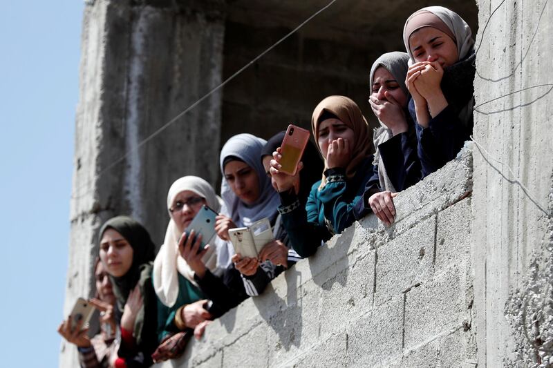 Mourners watch the funeral of Palestinian Ahmed Manasrah, near Bethlehem, in the Israeli-occupied West Bank. Reuters